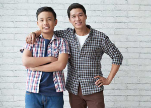 Two young men smiling. Men and eating disorders